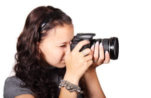 A student taking a picture with a digital camera