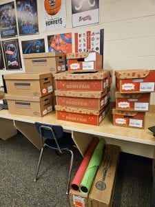 Boxes of books and materials from the Scholastic book fair